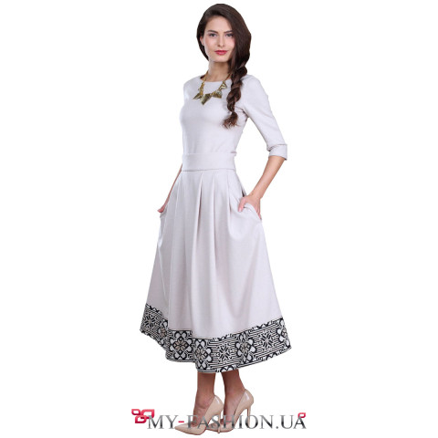 Юбка бежевого цвета с орнаментом по низу Юбка бежевого цвета с орнаментом по низу